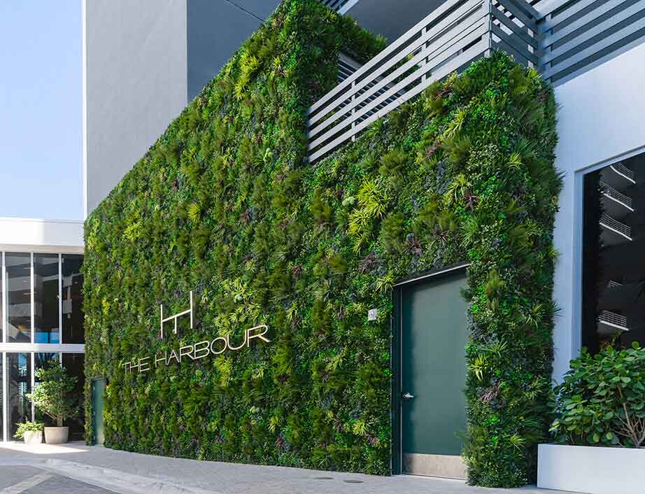 artificial plant walls on commercial building exteriors